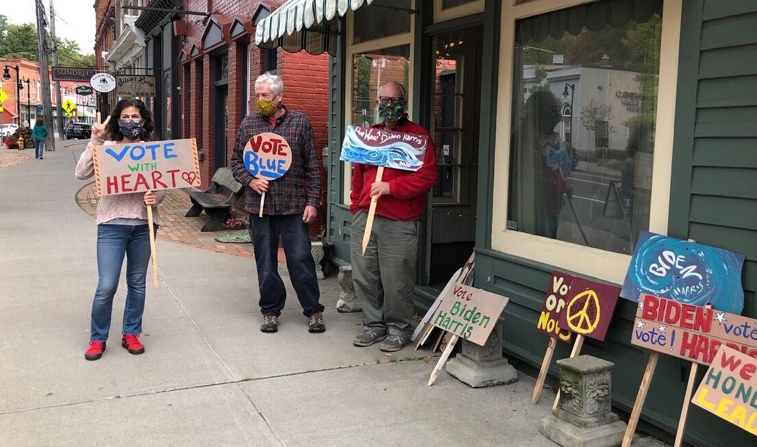 Left to right: Amy Puryear and Alan Vogel, of Trumansburg, and Mike Pitzrick, of Dryden, gathered in Trumansburg last week to make signs for #PaintTheVote.